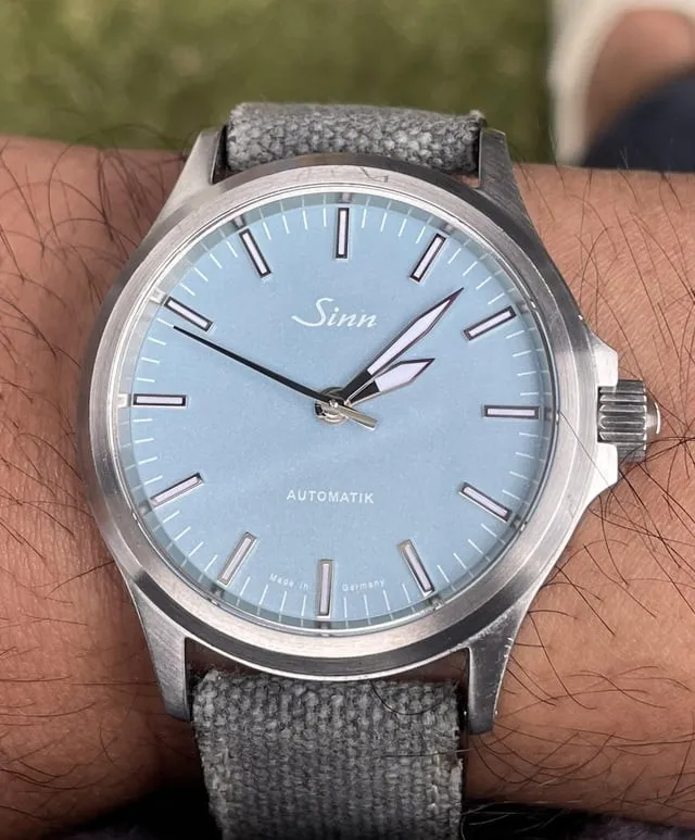 Sinn 556 ice-blue dial on grey canvas strap, wrist shot