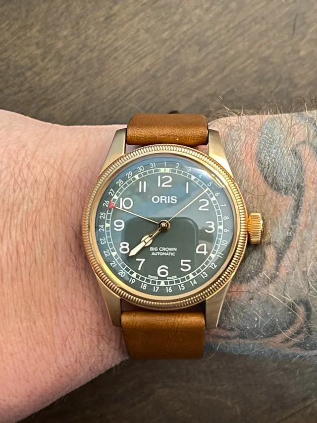 Oris Big Crown Pointer Date 80th Anniversary bronze case green dial on tan leather strap