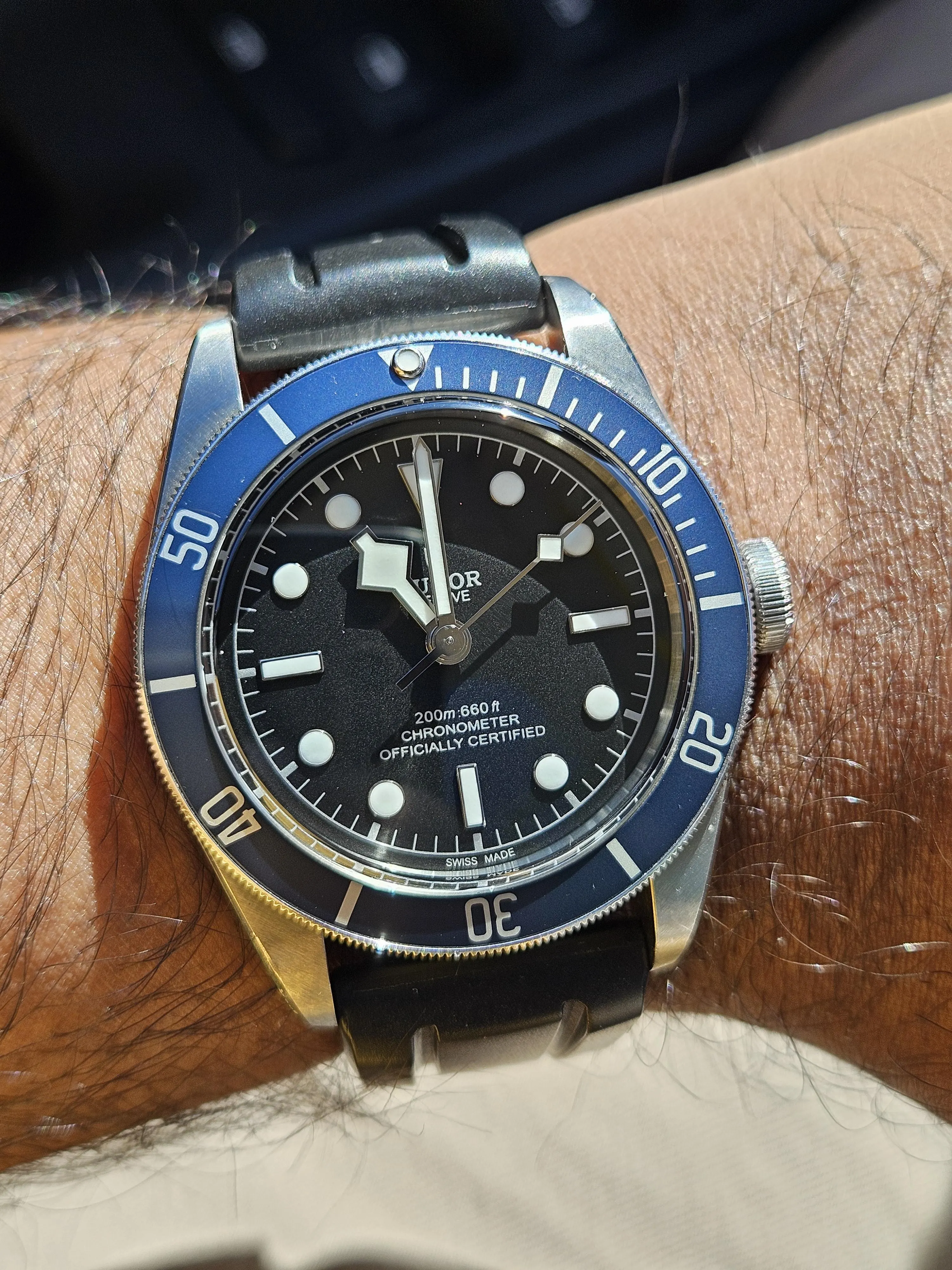Tudor Black Bay 41 blue bezel black dial on leather strap on wrist