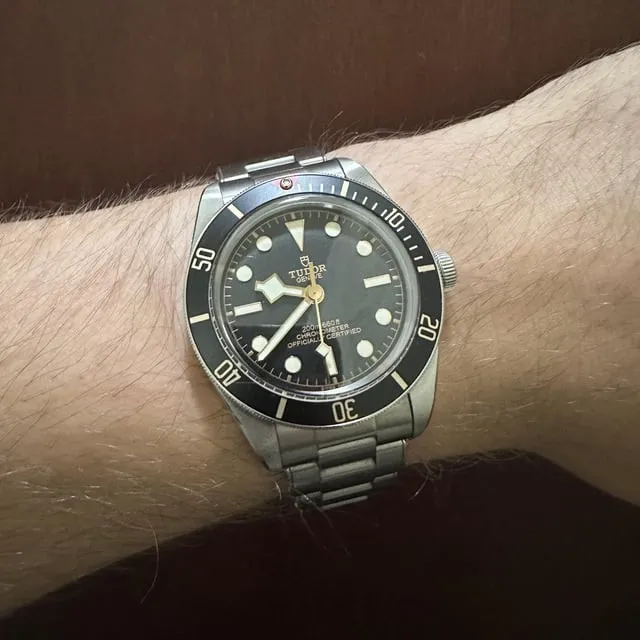 Tudor Black Bay 58 on wrist, black dial, gilt snowflake hands, five-link steel bracelet