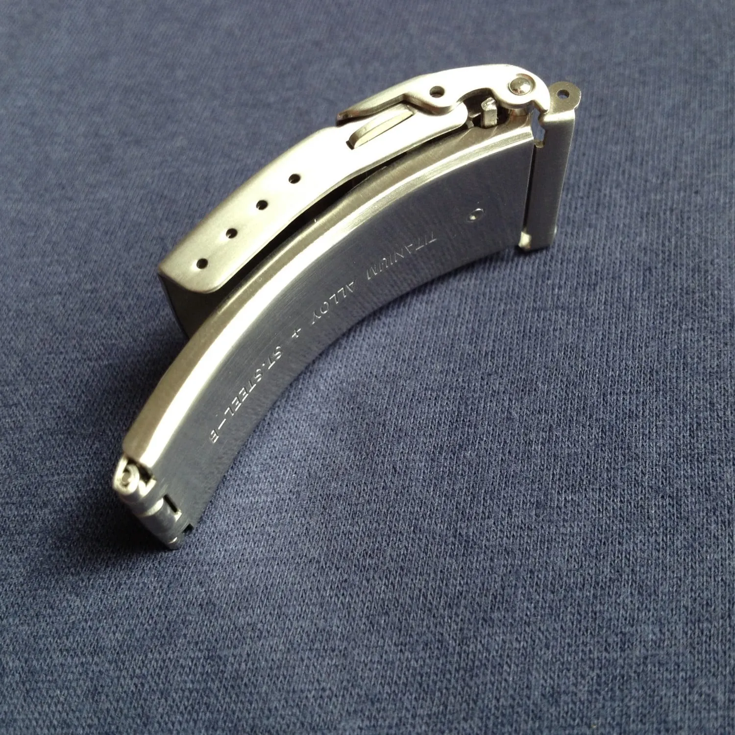 Titanium alloy and steel folding bracelet clasp showing inner adjustment mechanism