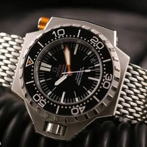 Omega Ploprof flat-lay showing black unidirectional dive bezel with white markings and orange hand