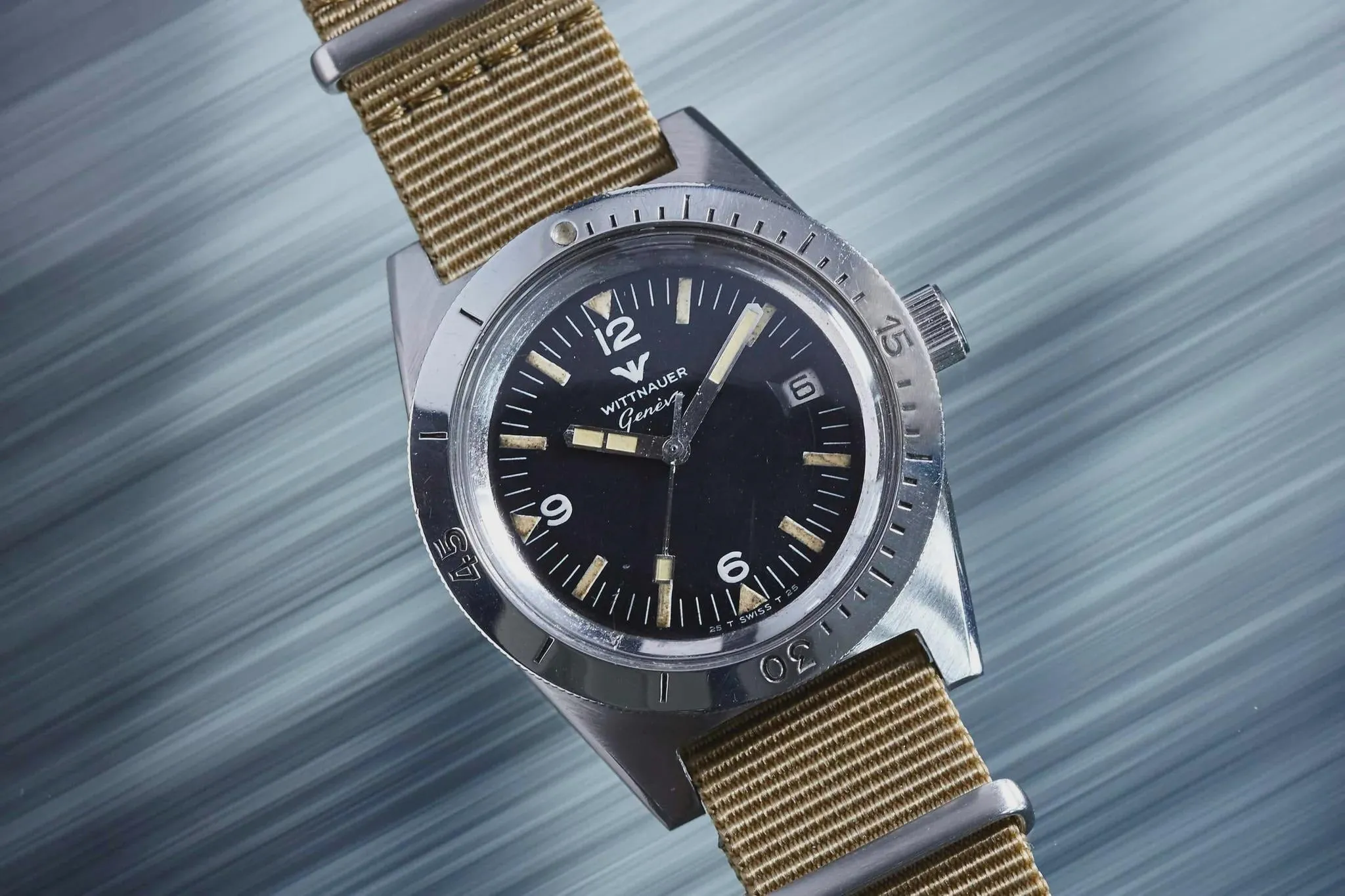 Vintage Wittnauer Genève diver on khaki NATO strap, black dial, coin-edge bezel