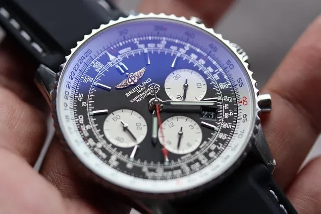 Breitling Navitimer crystal showing blue-violet AR coating tint under light