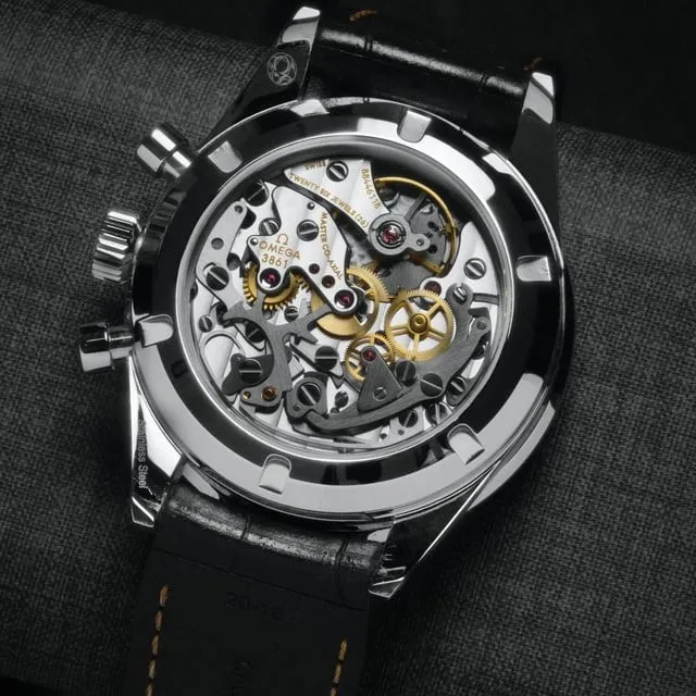 Omega Speedmaster exhibition caseback showing Cal. 3861 movement with gold escape wheel