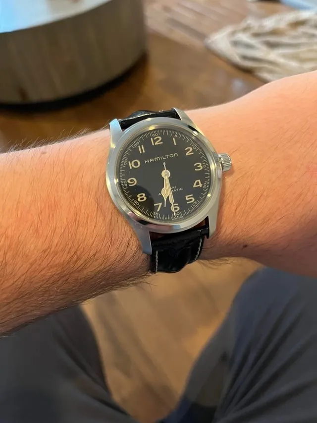 Hamilton Khaki Field Murph 42mm on wrist, black dial, croc leather strap, clear case proportion.