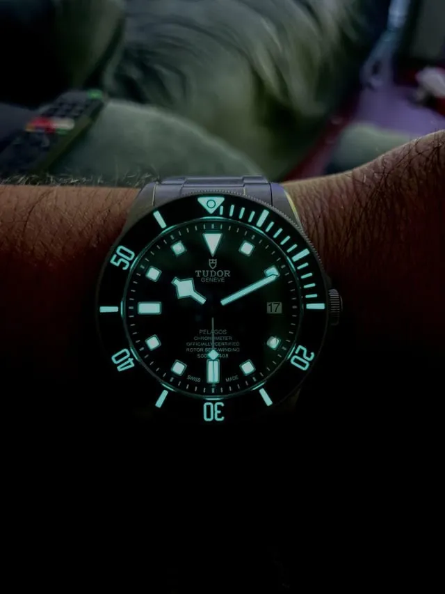 Tudor Pelagos glowing green lume on snowflake hands and markers in darkness