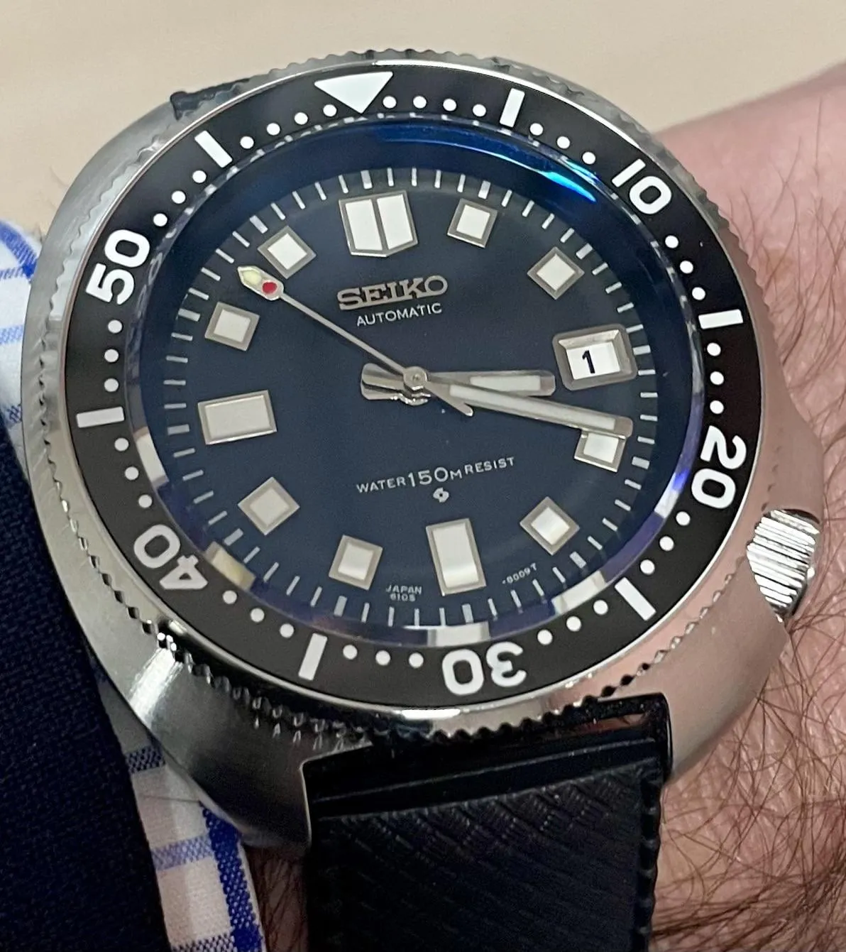 Seiko Prospex blue dial diver on wrist, crown visibly at 4 o'clock position