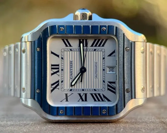 Cartier Santos large, blue PVD bezel with screw-set links, striped white dial, date window