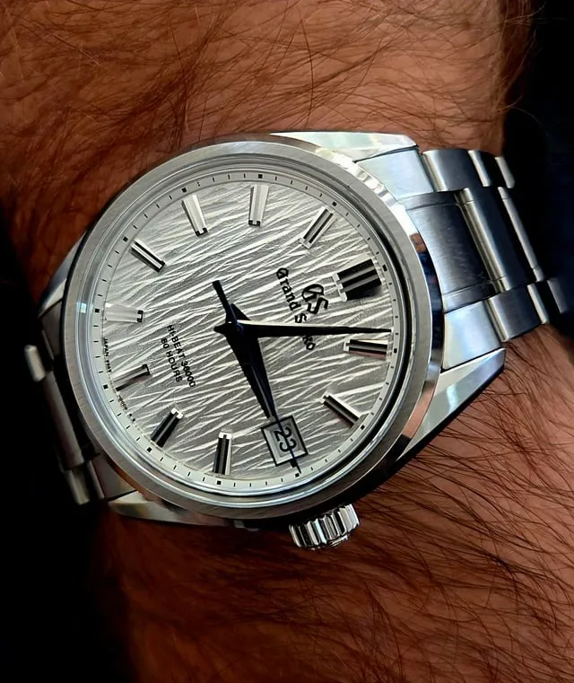 Grand Seiko SLGH005 white birch dial on steel bracelet, worn on wrist