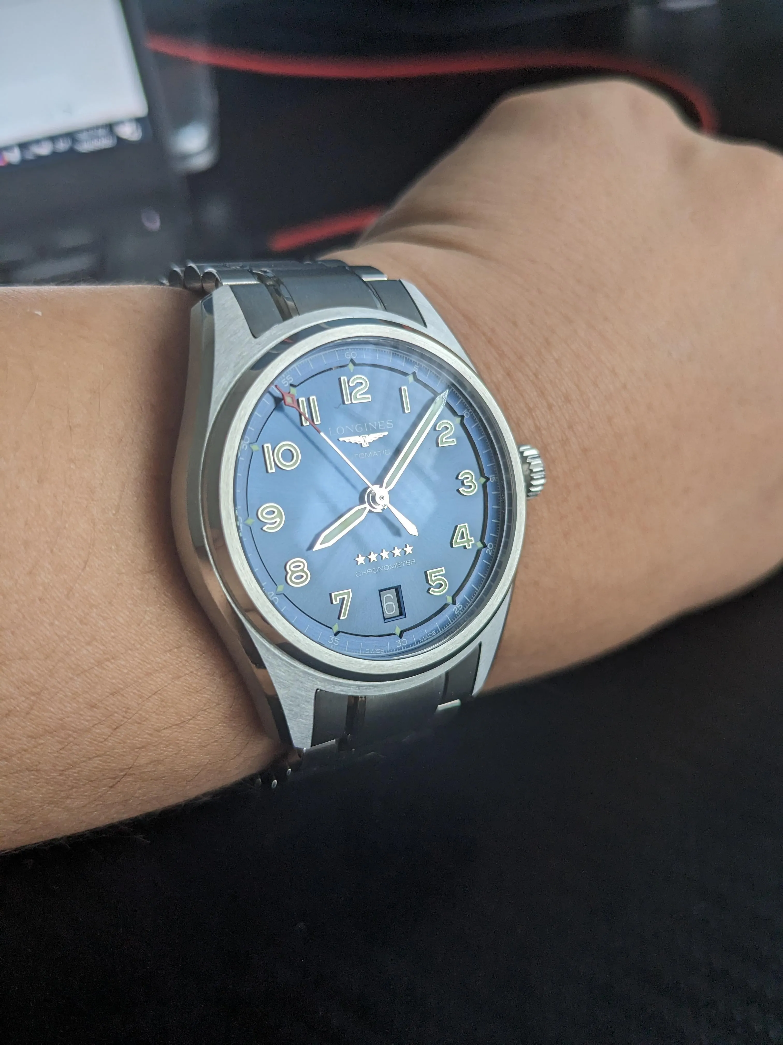 Longines Spirit blue dial wrist shot, Arabic numerals, dauphine hands, steel bracelet